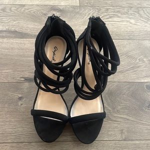 Strappy black platform heels